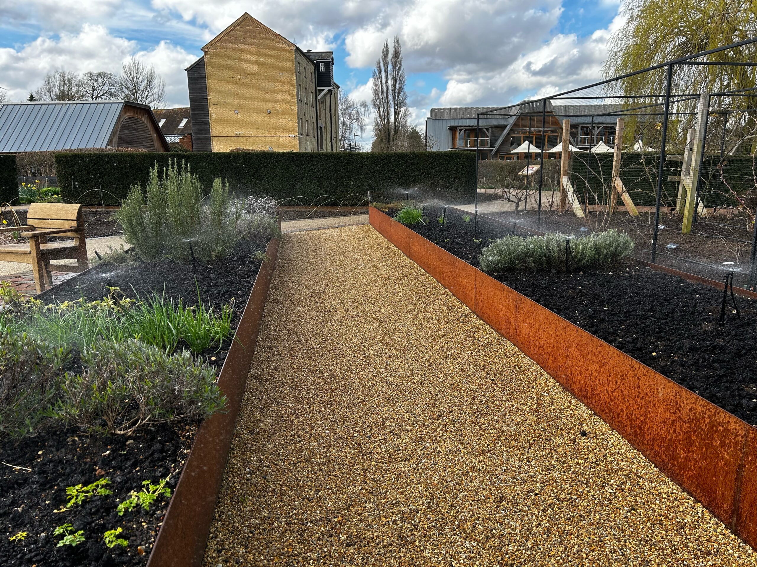 Irrigation for raised beds including micro sprays